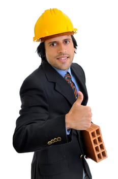 Engineer with a brick isolated in white