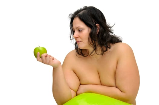 Beautiful nude large girl with an apple isolated in white