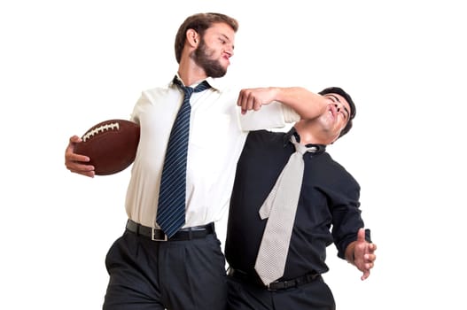 Businessmen playing rugby isolated in white