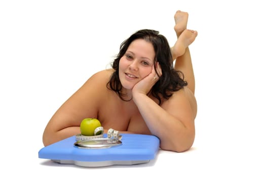 Beautiful nude large girl with weight scale isolated in white