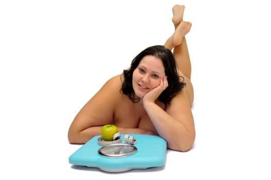 Beautiful nude large girl with weight scale isolated in white