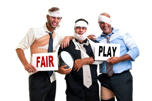 Group of injured businessmen after a rugby game with the words Fair play