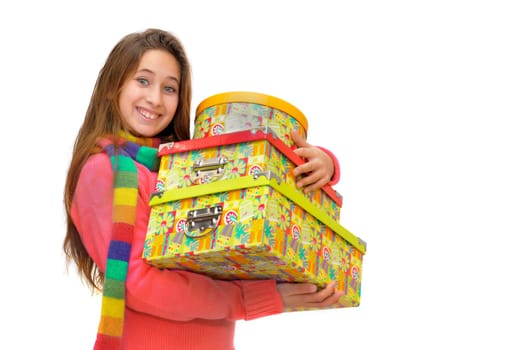 Beautiful young girl with present boxes isolated in white