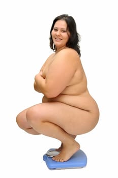 Beautiful large girl with weight scale isolated in white