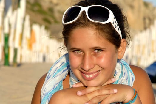Beautiful young girl posing in the beach
