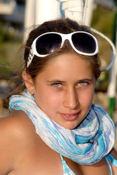 Beautiful young girl posing in the beach