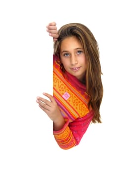 Beautiful young girl posing behind a white card isolated against a white background