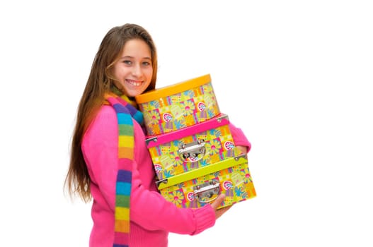 Beautiful young girl with present boxes isolated in white