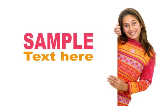 Beautiful young girl posing behind a white card isolated against a white background