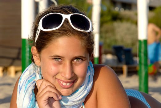 Beautiful young girl posing in the beach
