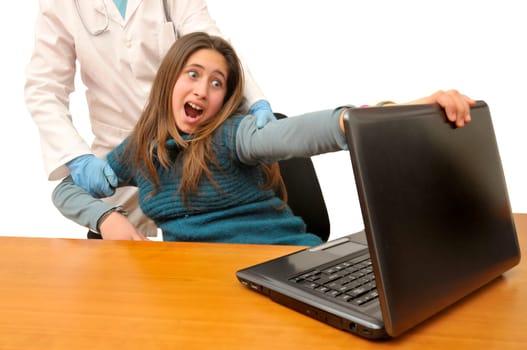 Stressed young girl in front of a laptop computer
