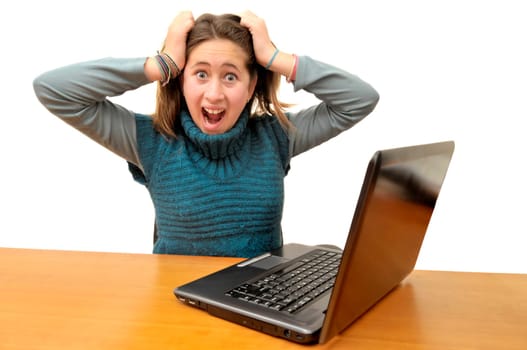 Stressed young girl in front of a laptop computer