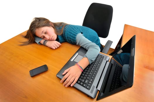 Young girlsleeping in front of a laptop computer