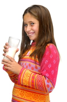 Beautiful young girl drinking milk against a white background