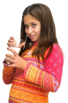 Beautiful young girl drinking milk against a white background