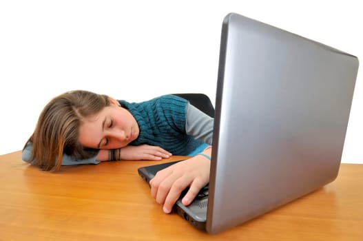 Young girlsleeping in front of a laptop computer
