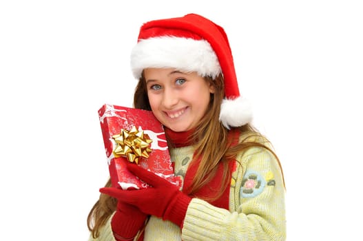 Beautiful young girl with santas hat and shopping bags isolated in white
