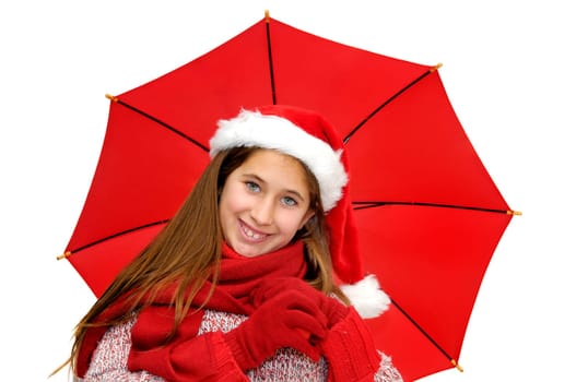 Beautiful young girl with santas hat and red umbrella isolated in white
