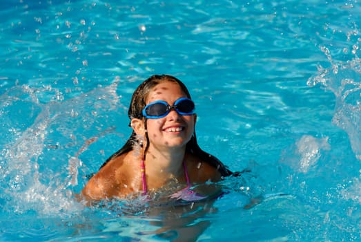 Young girl playing in the water