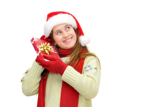 Beautiful young girl with santas hat and shopping bags isolated in white