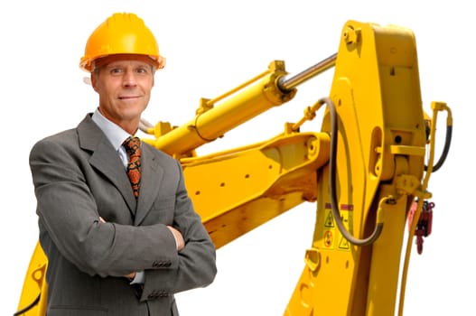Mature engineer with heavy machinery in the background