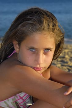Beautiful young girl posing in the beach