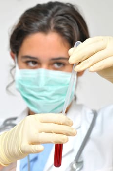 Young doctor analyzing a blood sample