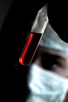Young doctor analyzing a blood sample