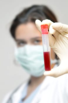 Young doctor analyzing a blood sample