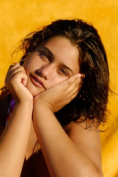 Beautiful young girl with wet hair, posing