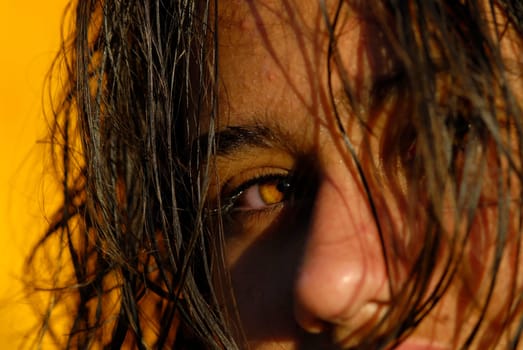 Beautiful young girl with wet hair, looking