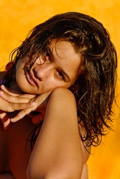 Beautiful young girl posing with wet hair