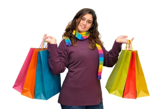 Beautiful teen with colorful bags isolated in white