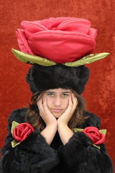 Beautiful girl with roses isolated in a red background