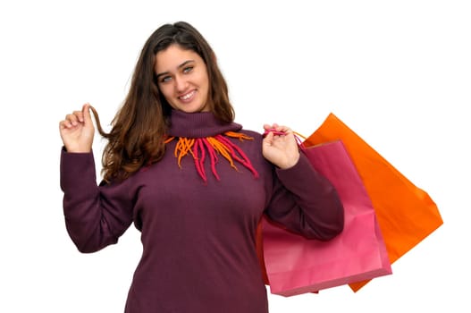 Beautiful teen with colorful bags isolated in white