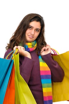 Beautiful teen with colorful bags isolated in white