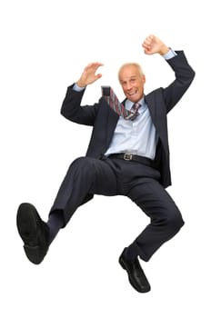 Mature businessman jumping isolated in white