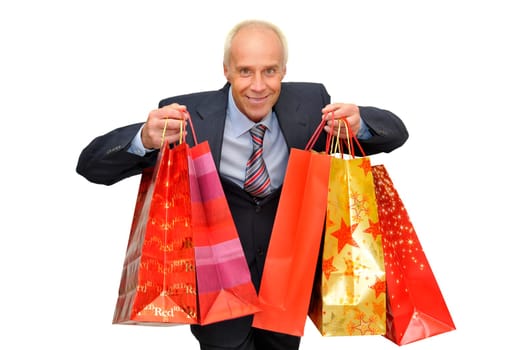 Mature businessman with lots of bags shopping isolated in white