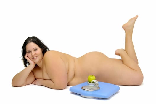 Beautiful large girl with weight scale isolated in white