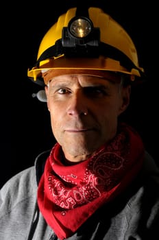 Portrait of a worker isolated in black