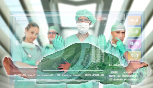 Doctors team with pregnant pacient in medical facilities with modern screen