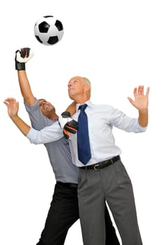 Two businessmen playing soccer isolated in white