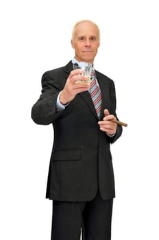 Mature businessman with whisky and cigar isolated in white