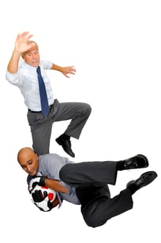 Two businessmen playing soccer isolated in white