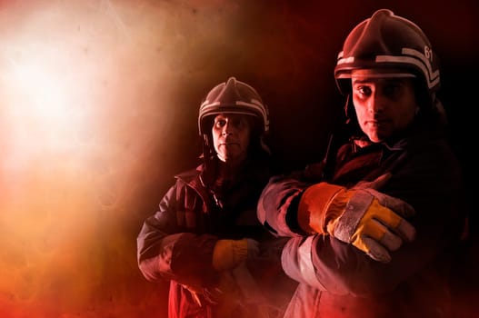Dramatic image of firemen team in uniform