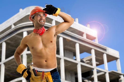 Strong build construction worker in a construction site