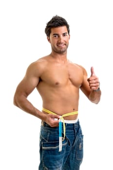 Muscular young man with measuring tape