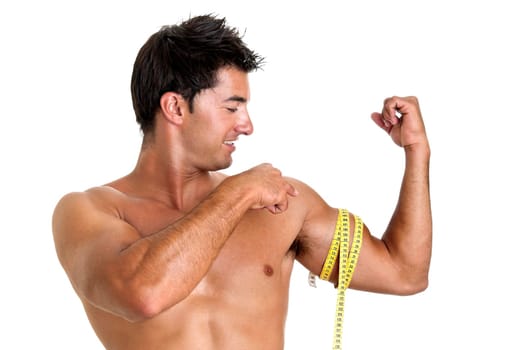 Muscular young man with measuring tape