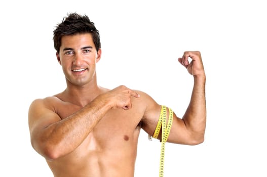 Muscular young man with measuring tape
