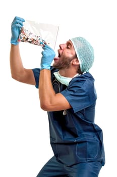 Doctor with pills against a white background